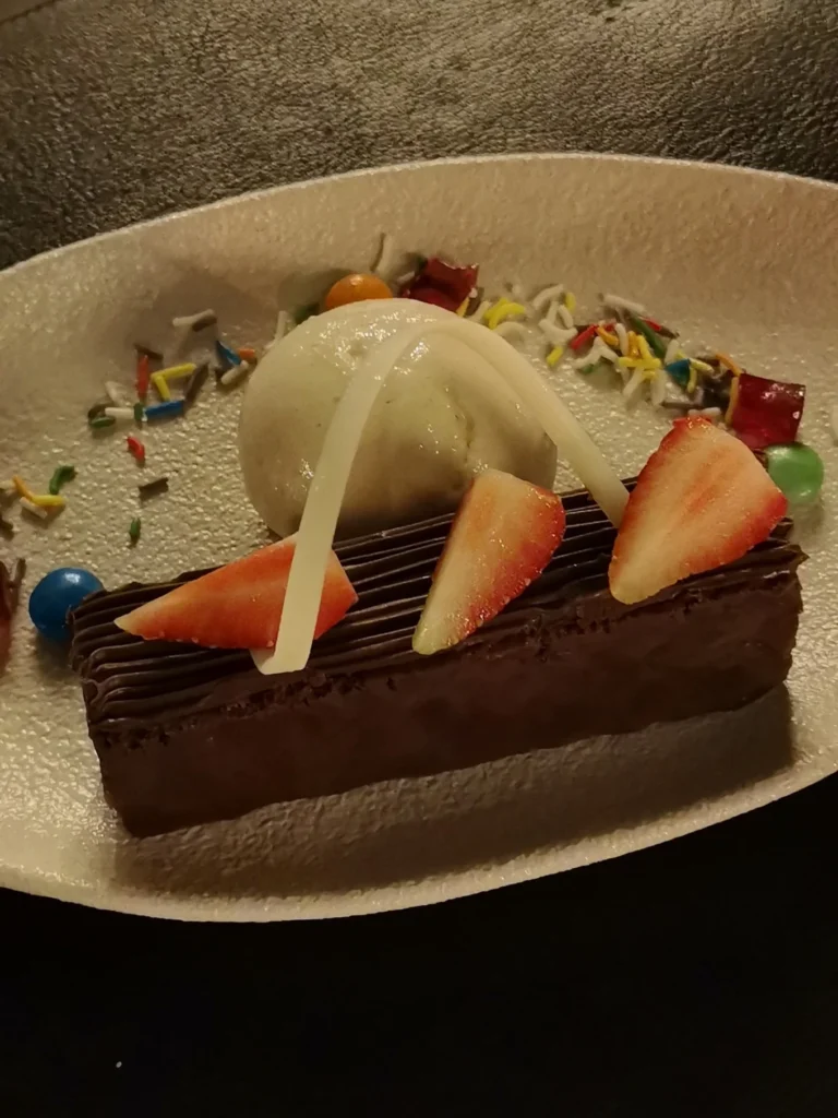 Chocolate dessert with strawberries and ice cream at Terra Mare restaurant Danang
