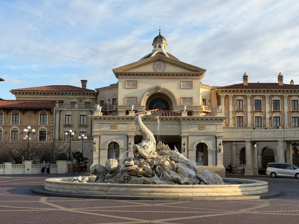 Entrance of Tokyo DisneySea Hotel MiraCosta with grand Italian-style architecture and fountain in front