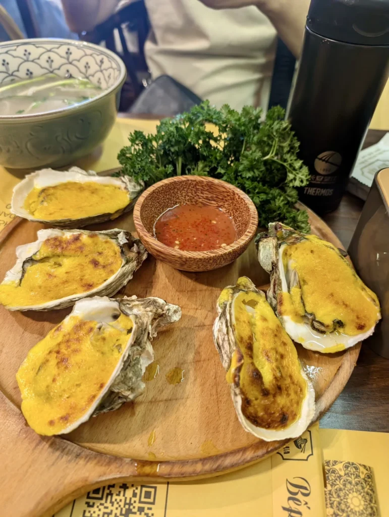 Bếp Lụa Vietnamese Restaurant Review (Da Nang): Worth Skipping Michelin Queues For? 8 Cheese baked oysters served at Bếp Lụa Vietnamese restaurant Da Nang