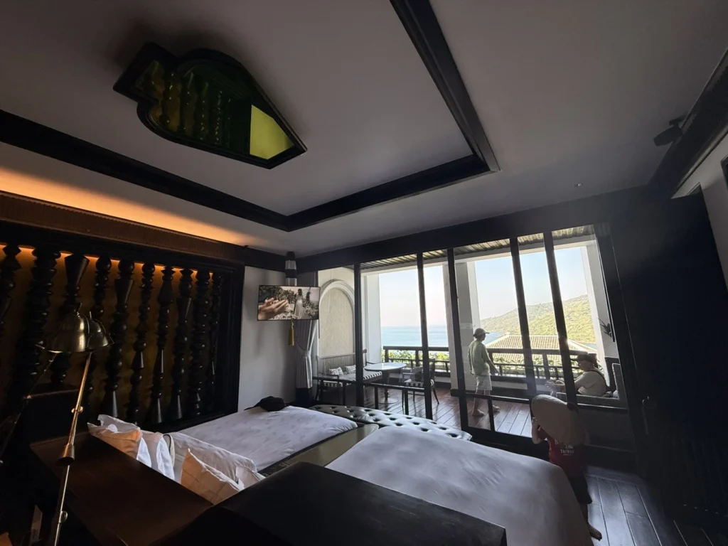 Bedroom with twin beds and balcony ocean view at InterContinental Danang Sun Peninsula Resort