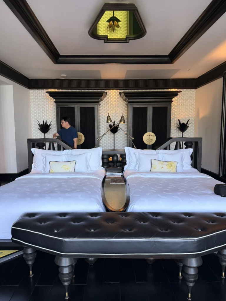 Twin bed setup with artistic black furniture at InterContinental Danang Sun Peninsula Resort