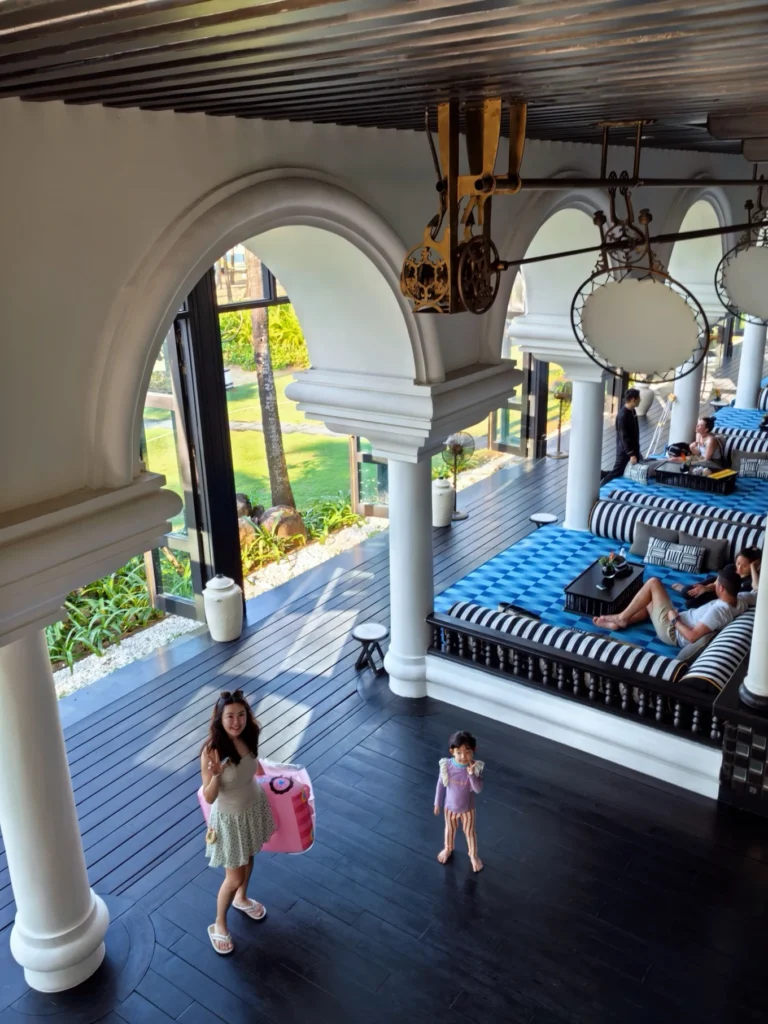 Open lobby with arches and seating area overlooking greenery at InterContinental Danang Sun Peninsula Resort