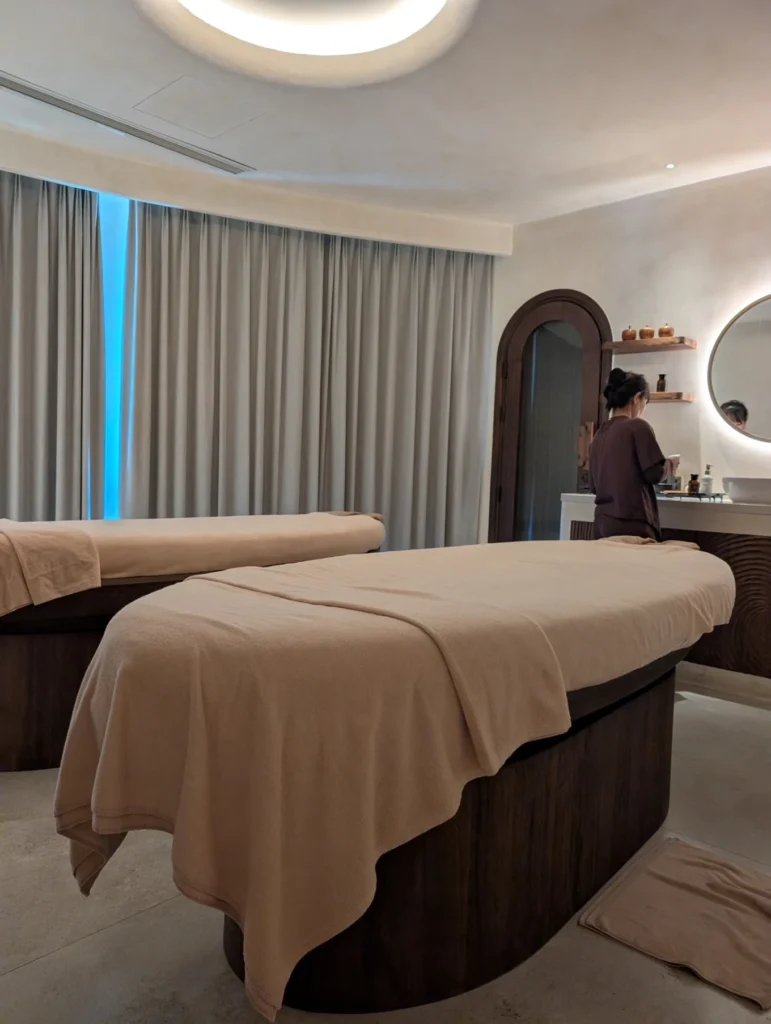 Namia River Retreat spa room with massage beds and calming interior design