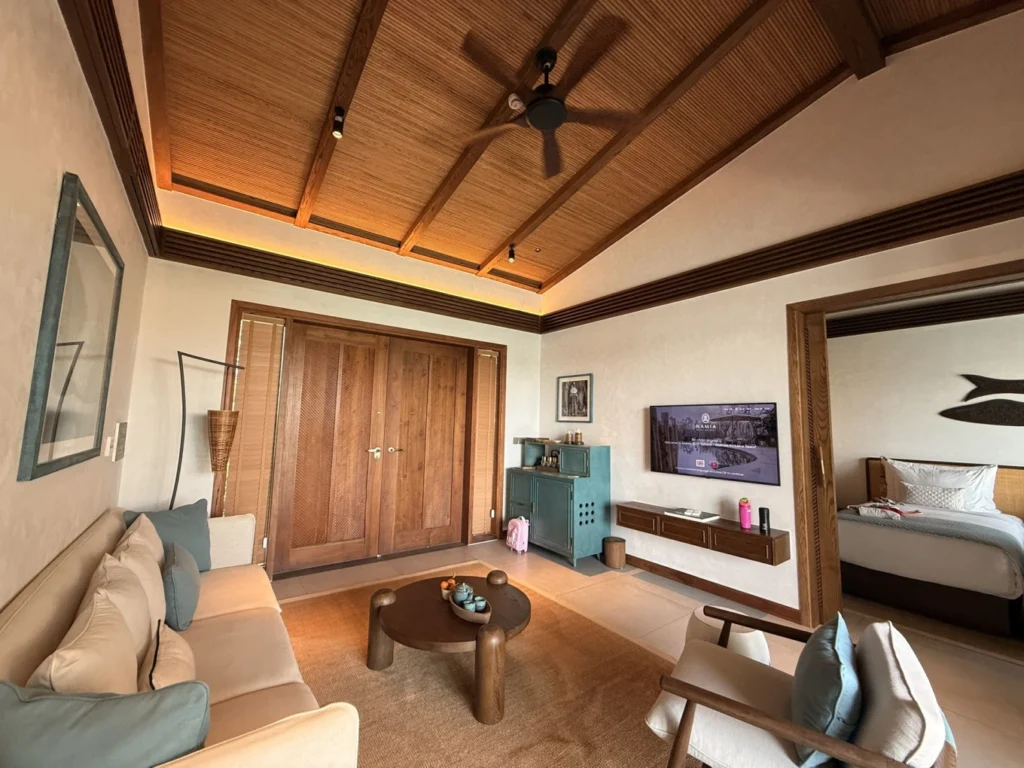 Namia River Retreat villa living room with modern wooden interior and sofa