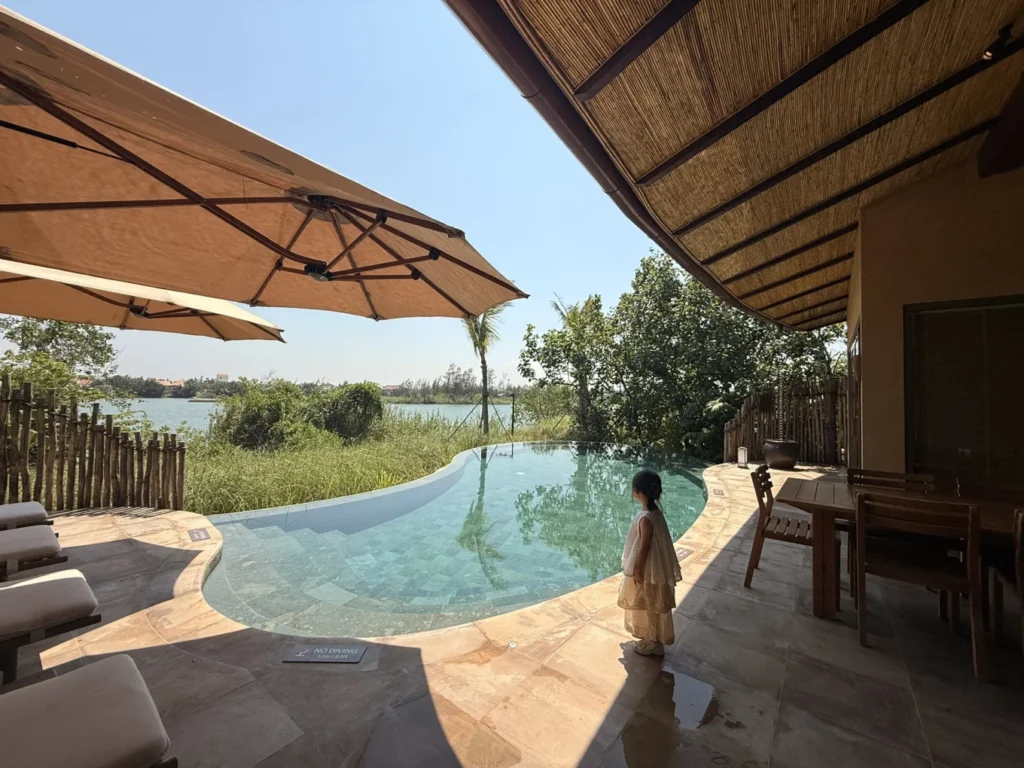 Private villa pool at Namia River Retreat with river and greenery views