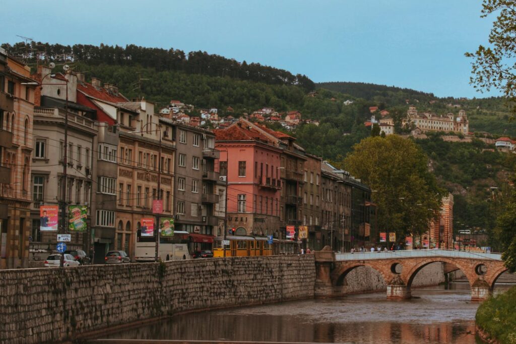 Sarajevo old town with Miljacka River, historic buildings, and stone bridge in Bosnia and Herzegovina