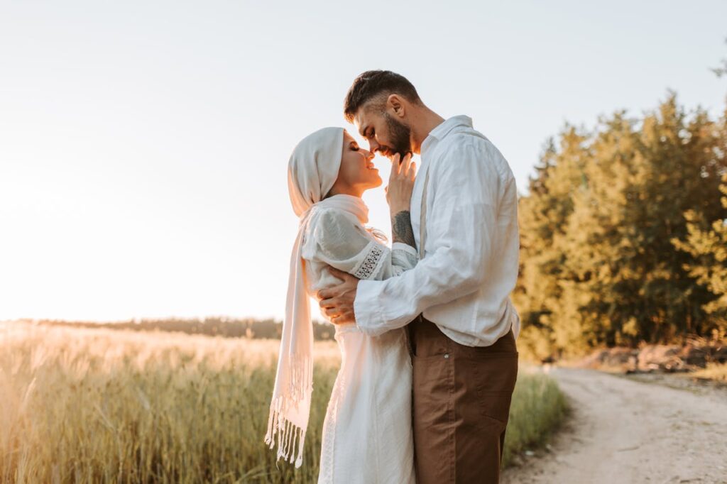 5 Best Halal Honeymoon Resorts in Bali: Villas & Muslim-Friendly Stays 5 Muslim couple on honeymoon embracing outdoors representing halal honeymoon travel experience