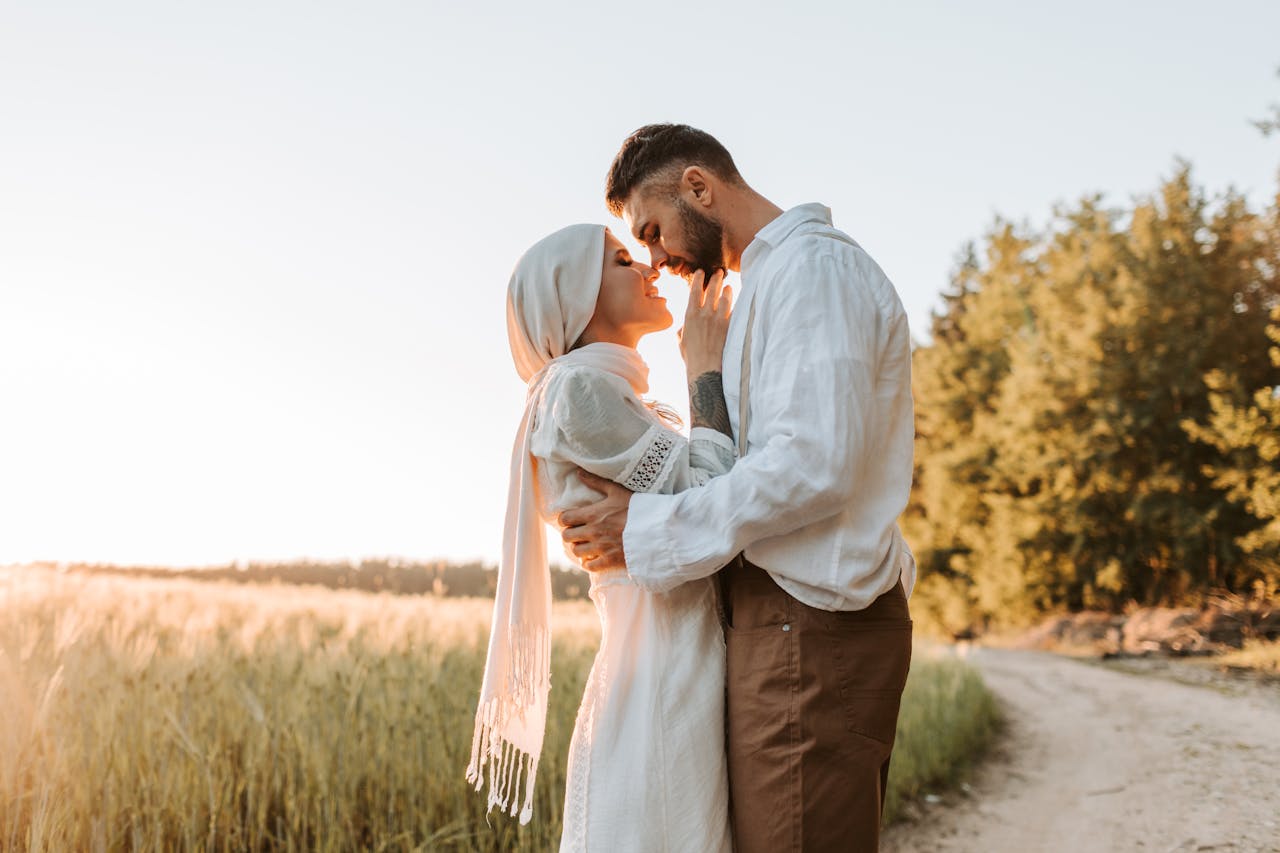Muslim couple on honeymoon embracing outdoors representing halal honeymoon travel experience
