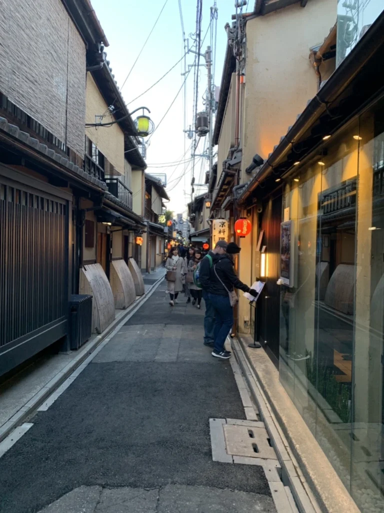 Pontocho Alley Kyoto Guide: Best Time to Visit, Food & What to Expect 5 Quiet section of Pontocho Alley Kyoto with traditional restaurants and menu displays along narrow pathway