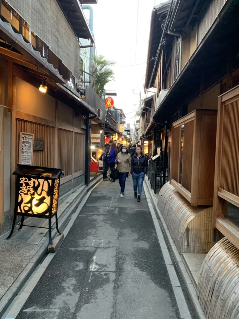 Pontocho Alley Kyoto Guide: Best Time to Visit, Food & What to Expect 7 Pontocho Alley Kyoto traditional street with wooden facades and lantern signage in evening light