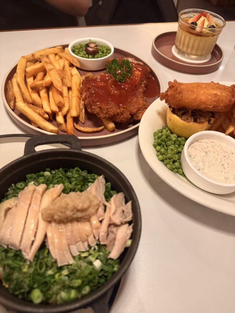 Seng House Review: Big Portions, Mixed Flavours & Must-Try Dish 14 Seng House dishes including fish and chips, Hainanese pork chop and claypot chicken rice close-up