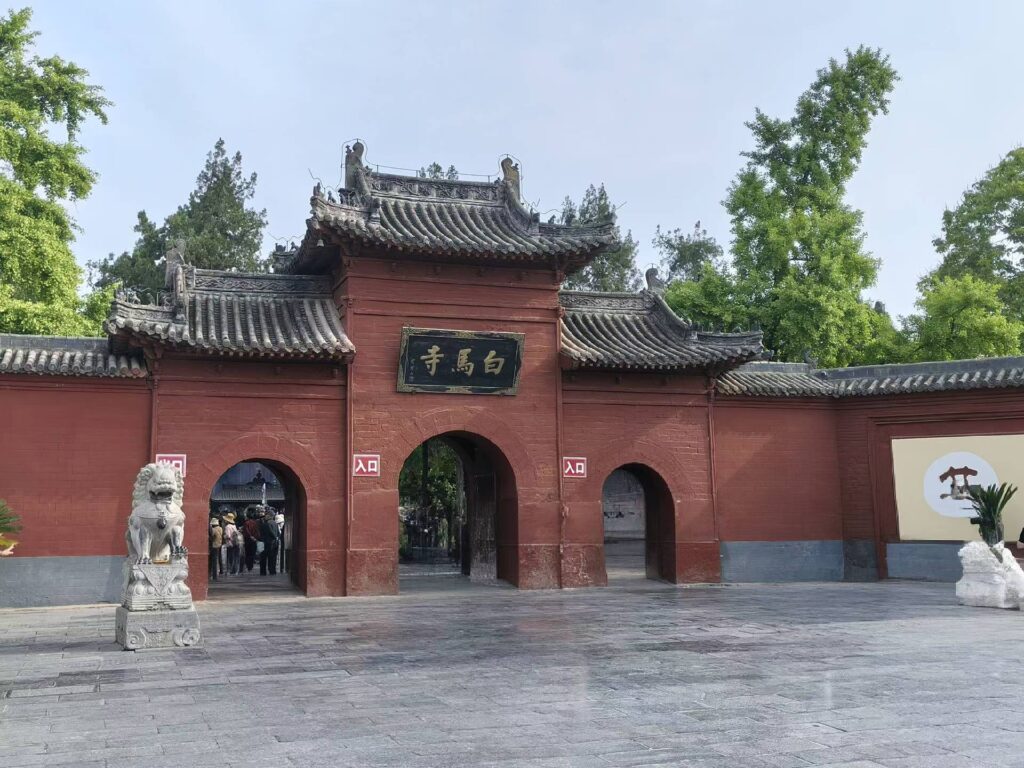 Main entrance of White Horse Temple with red walls and traditional Chinese gate