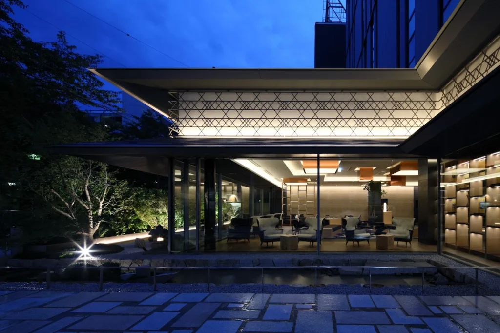 10 Best Muslim-Friendly Hotels (Halal) In Kyoto 12 Modern illuminated exterior and lounge area of Cross Hotel Kyoto in Kyoto, Japan at night