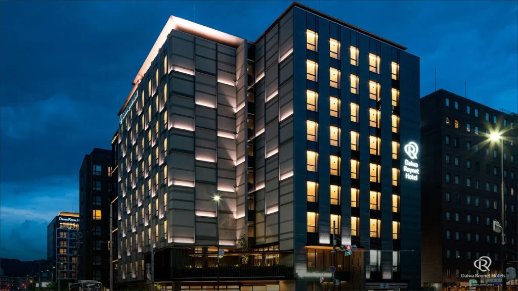 10 Best Hotels Near Fushimi Inari Shrine 11 Daiwa Roynet Hotel Kyoto Terrace Hachijo PREMIER illuminated at night with modern architecture near Kyoto Station and Fushimi Inari Shrine.