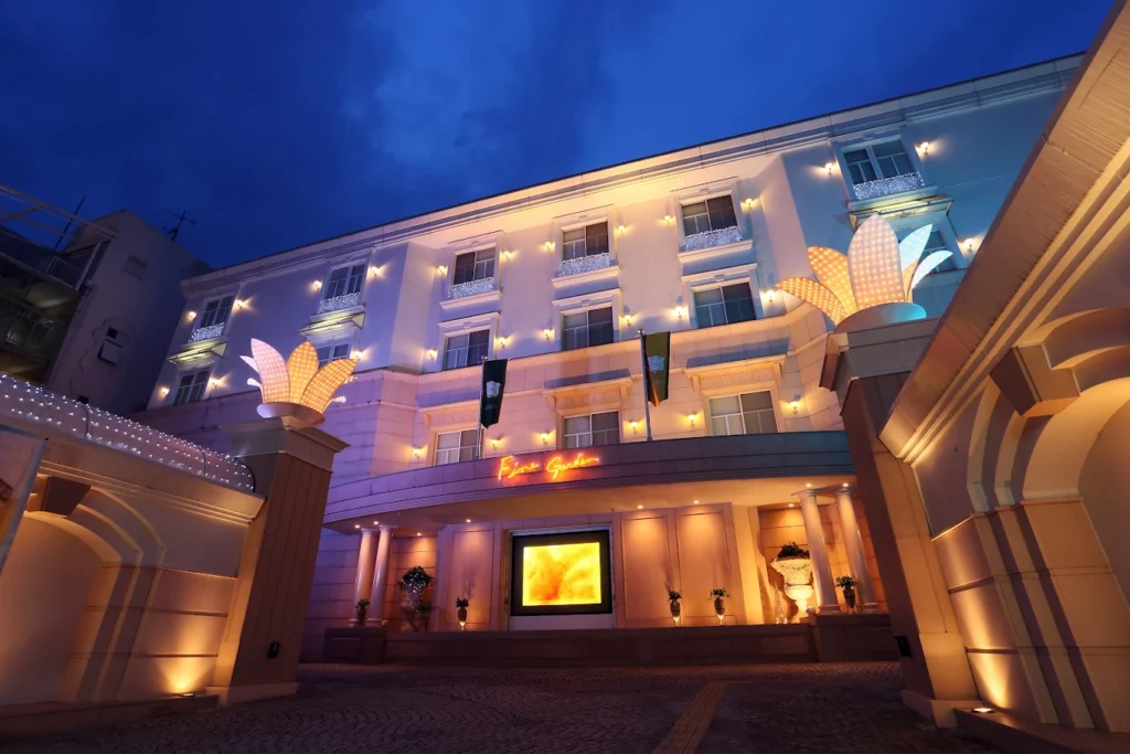 10 Best Hotels Near Fushimi Inari Shrine 5 Hotel Fine Garden Kyoto Minami illuminated at night with elegant exterior lighting and grand entrance near Fushimi Inari Shrine in Kyoto.