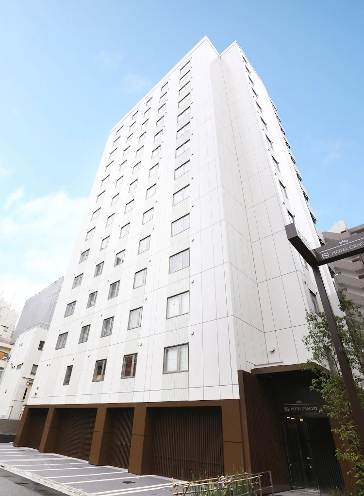 Exterior of Hotel Gracery Asakusa in Tokyo featuring a modern white high-rise design near Asakusa Station and Sensō-ji Temple.