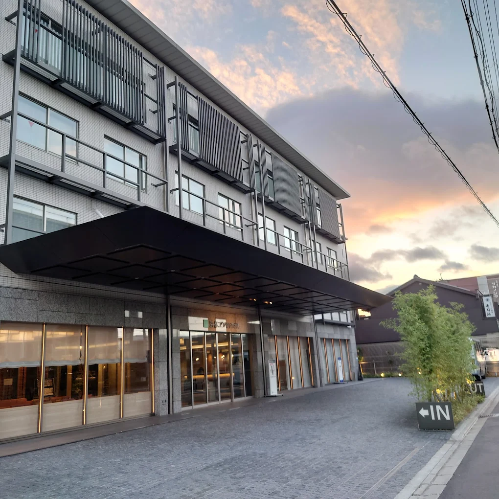 10 Best Hotels Near Fushimi Inari Shrine 9 Kyoto U-Bell Hotel exterior at sunset featuring modern architecture and family-friendly accommodations near Fushimi Inari Shrine in Kyoto.