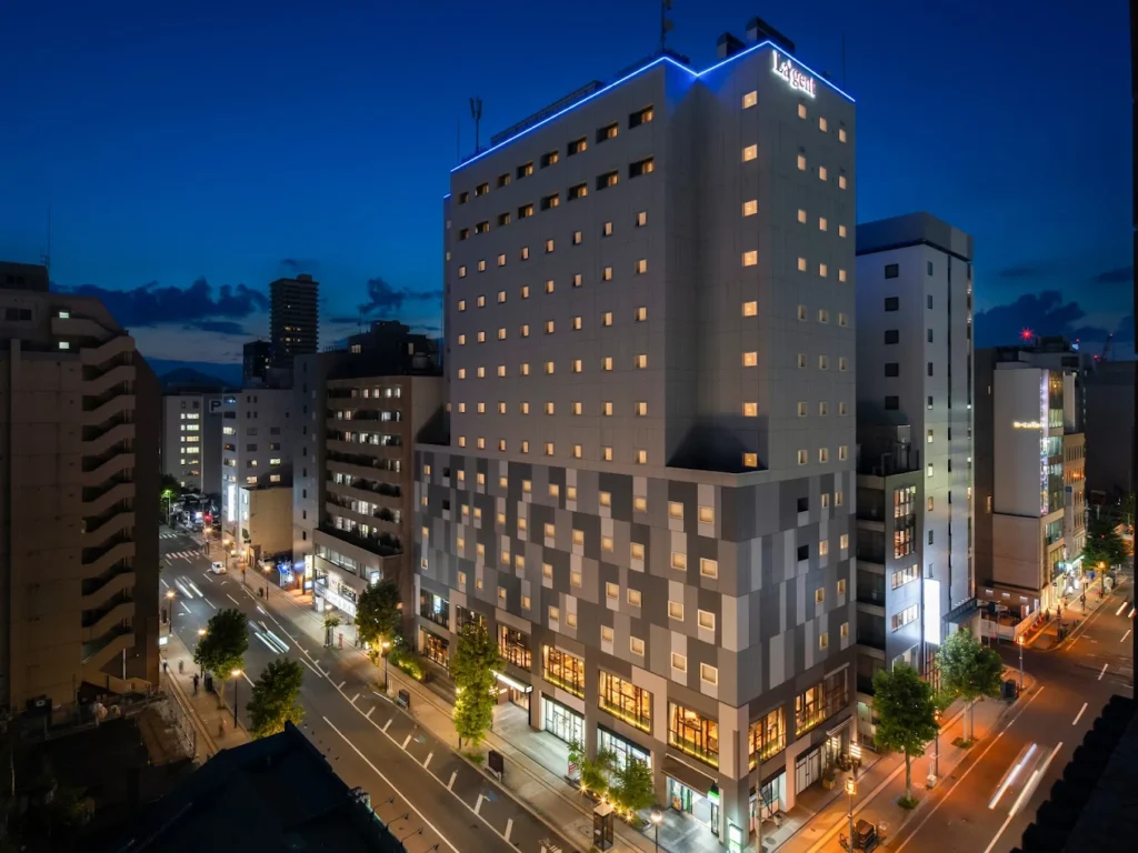 Night view of La’gent Stay Sapporo Odori hotel illuminated in downtown Sapporo near Odori Park