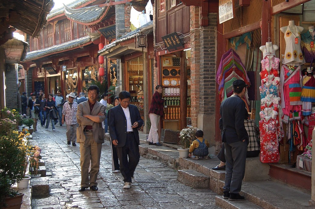 7 Underrated Cities in China Worth Visiting With Your Family 8 Busy old town shopping street with traditional Chinese architecture in Lijiang, Yunnan