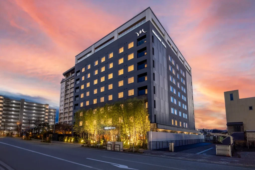 7 Best Hotels in Takayama Japan: Top Ryokans, Onsens & Family Stays 12 Exterior view of Mercure Hida Takayama hotel at sunset with modern architecture in Takayama Japan