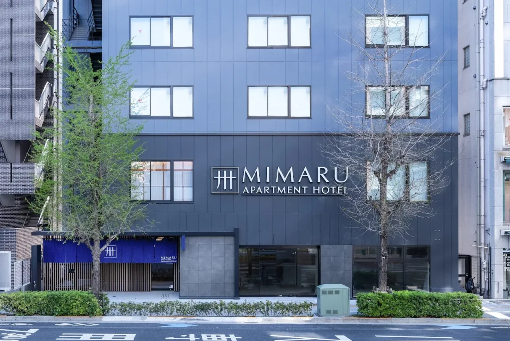Exterior of Mimaru Tokyo Asakusa Station apartment hotel in Tokyo, featuring a modern dark facade near Asakusa Station and Sensō-ji Temple.