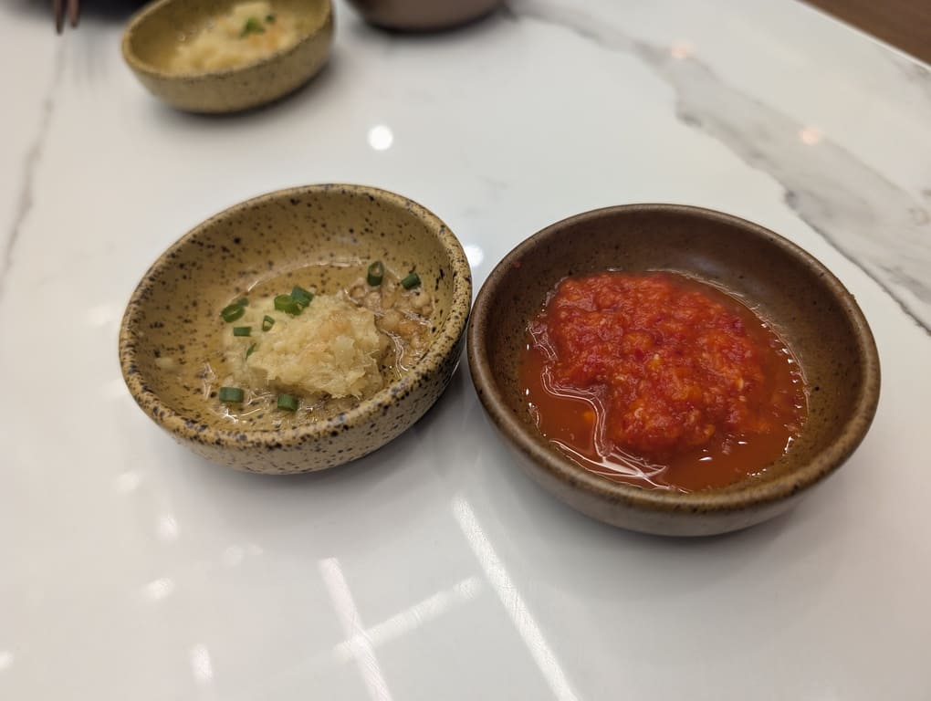 Mr Hainan VivoCity Review: Surprisingly Good Chicken Rice in Singapore 9 Garlic ginger sauce and spicy chili sauce served with Hainanese chicken rice at Mr Hainan.