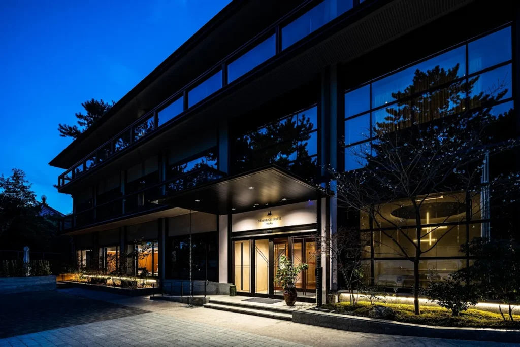 8 Best Hotels Near Nara Park: Luxury, Ryokan & Budget Stays 6 Exterior night view of Noborioji Hotel Nara near Nara Park with modern Japanese architecture and warm lighting