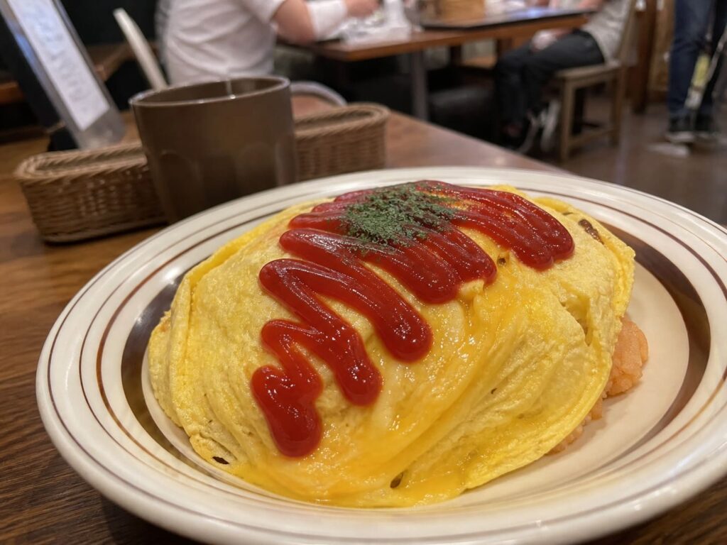 Kid-Friendly Foods to Try in Japan That Aren’t Sushi 7 Japanese omurice with soft omelette and ketchup served on a plate in a casual café