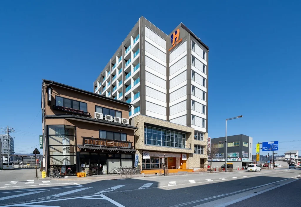 7 Best Hotels in Takayama Japan: Top Ryokans, Onsens & Family Stays 9 Exterior view of Residence Hotel Takayama Station located near JR Takayama Station in Japan