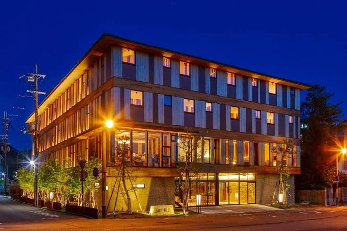 8 Best Hotels Near Nara Park: Luxury, Ryokan & Budget Stays 9 Night view of Setre Naramachi boutique hotel in Nara with warm lighting and modern Japanese-inspired design