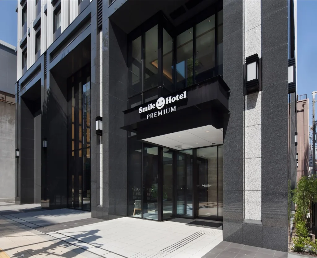 Entrance exterior of Smile Hotel Premium Osaka Higashi Shinsaibashi with modern black facade near central Osaka