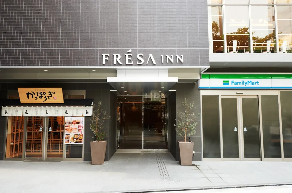 Entrance of Sotetsu Fresa Inn Osaka-Namba beside a FamilyMart convenience store near Namba Station in Osaka