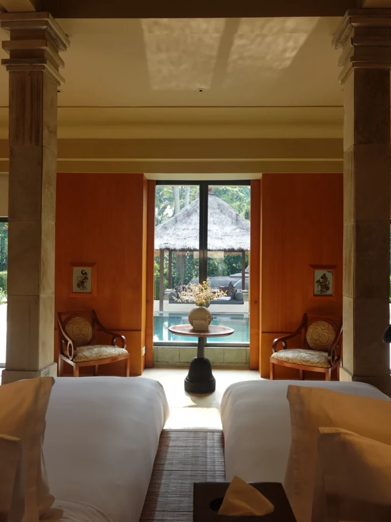 Amanjiwo Review: Is This Luxury Resort Near Borobudur Worth It? 24 Twin beds inside Amanjiwo suite with tropical outdoor pool view in Central Java