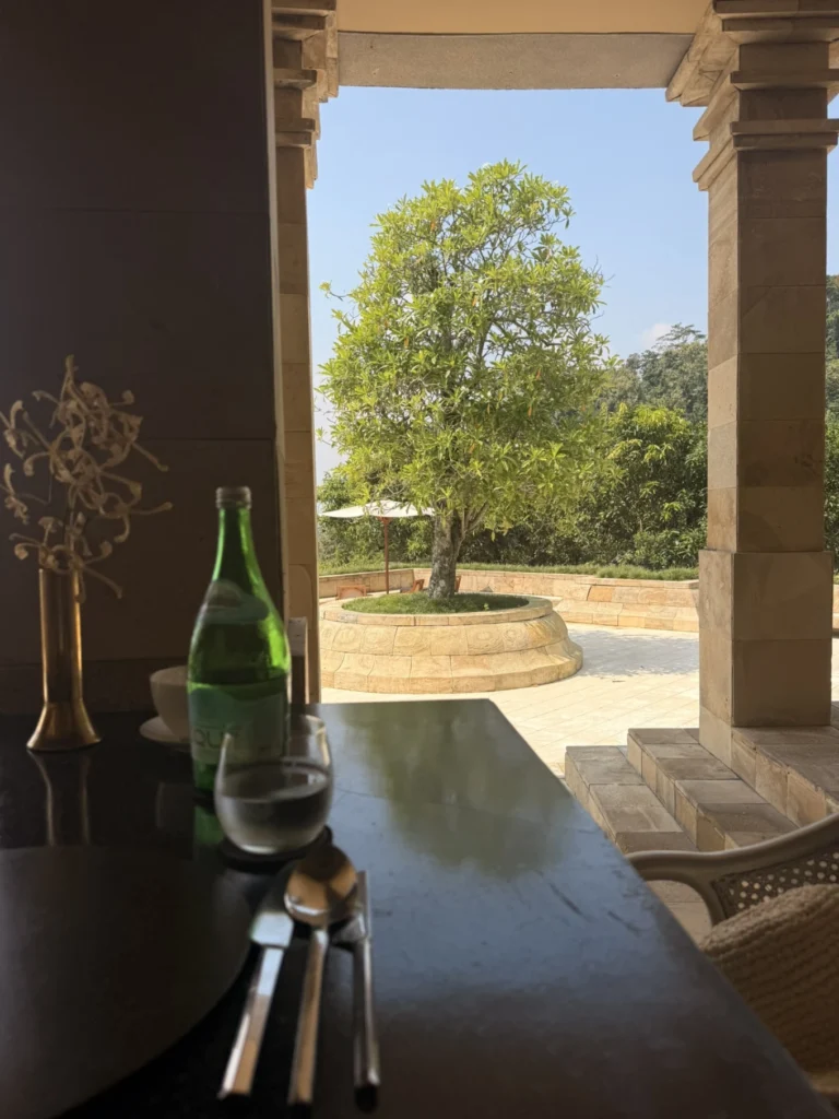 Amanjiwo Review: Is This Luxury Resort Near Borobudur Worth It? 14 Open-air dining area at Amanjiwo resort overlooking tropical gardens in Java Indonesia