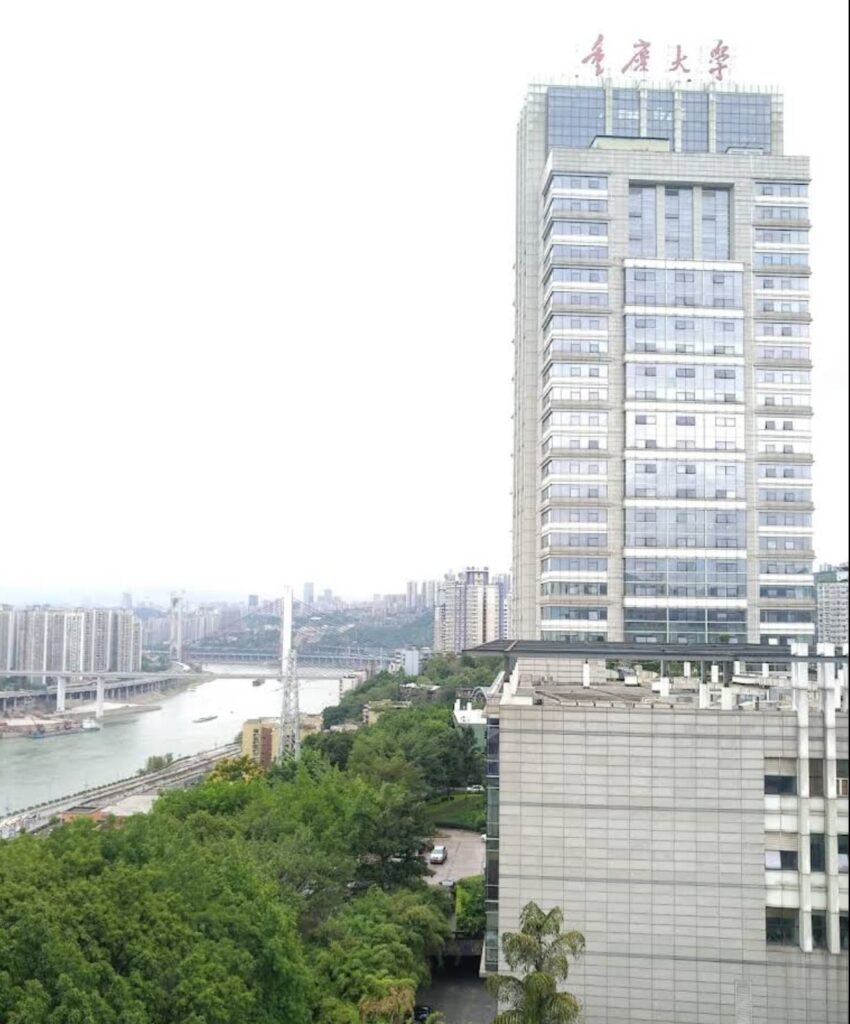 View of Chongqing University campus area in Shapingba District with riverside skyline and high-rise buildings