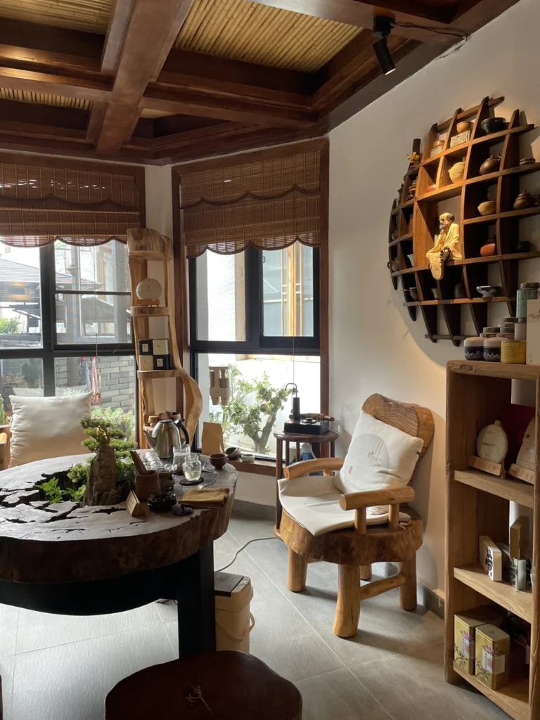 Qishe Inn Review: Cozy Family Stay Near Qingyan Ancient Town 5 Traditional tea corner and wooden lounge area inside Qishe Inn near Qingyan Ancient Town