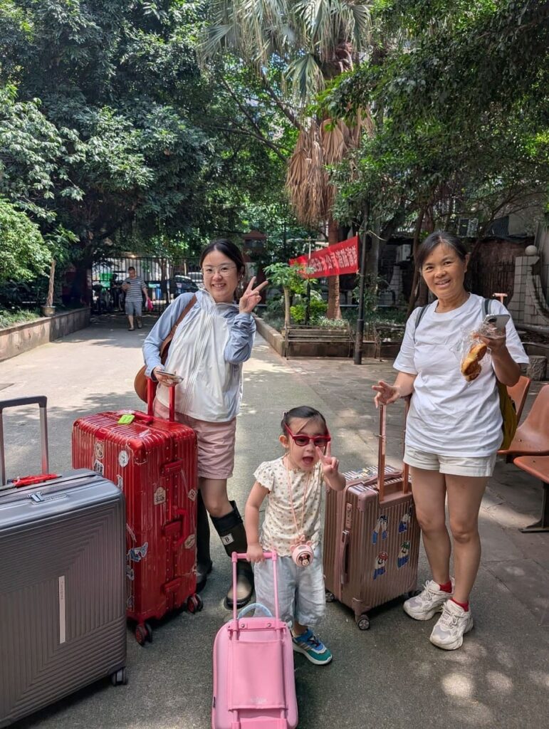 Family arriving in China with luggage and kids travel essentials during a multi-generational family trip