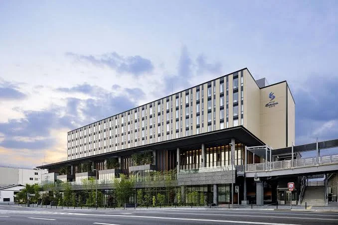 Hotel Emion Kyoto exterior at dusk, featuring modern architecture and direct access to public transportation in Kyoto, Japan