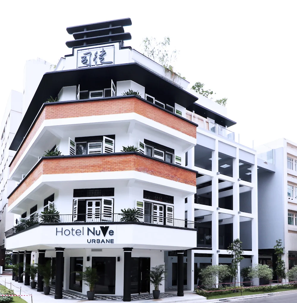 Exterior view of Hotel NuVe Urbane in Singapore, featuring a restored heritage-style building with modern extensions in the vibrant Kampong Glam district.