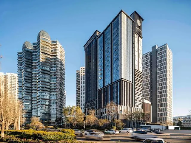 Pullman Dali hotel building with modern high-rise architecture in Dali, Yunnan, offering convenient access to Erhai Lake and city attractions
