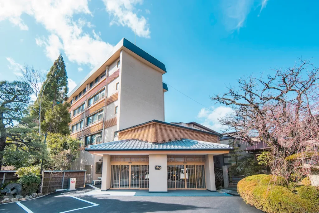 Ryokan Nenrinbo traditional Japanese inn surrounded by landscaped gardens and seasonal trees in Kyoto, Japan