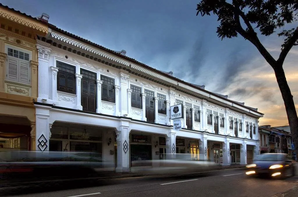 Historic shophouse-style exterior of Venue Hotel in Singapore's Katong district, featuring restored colonial architecture along a heritage street.