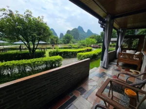 Yangshuo Mountain Retreat terrace overlooking the Yulong River and karst mountains in Yangshuo, China