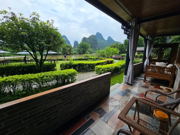 Yangshuo Mountain Retreat terrace overlooking the Yulong River and karst mountains in Yangshuo, China