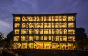 Yuyuan Jingshe hotel illuminated at night in the Yangshuo countryside, China