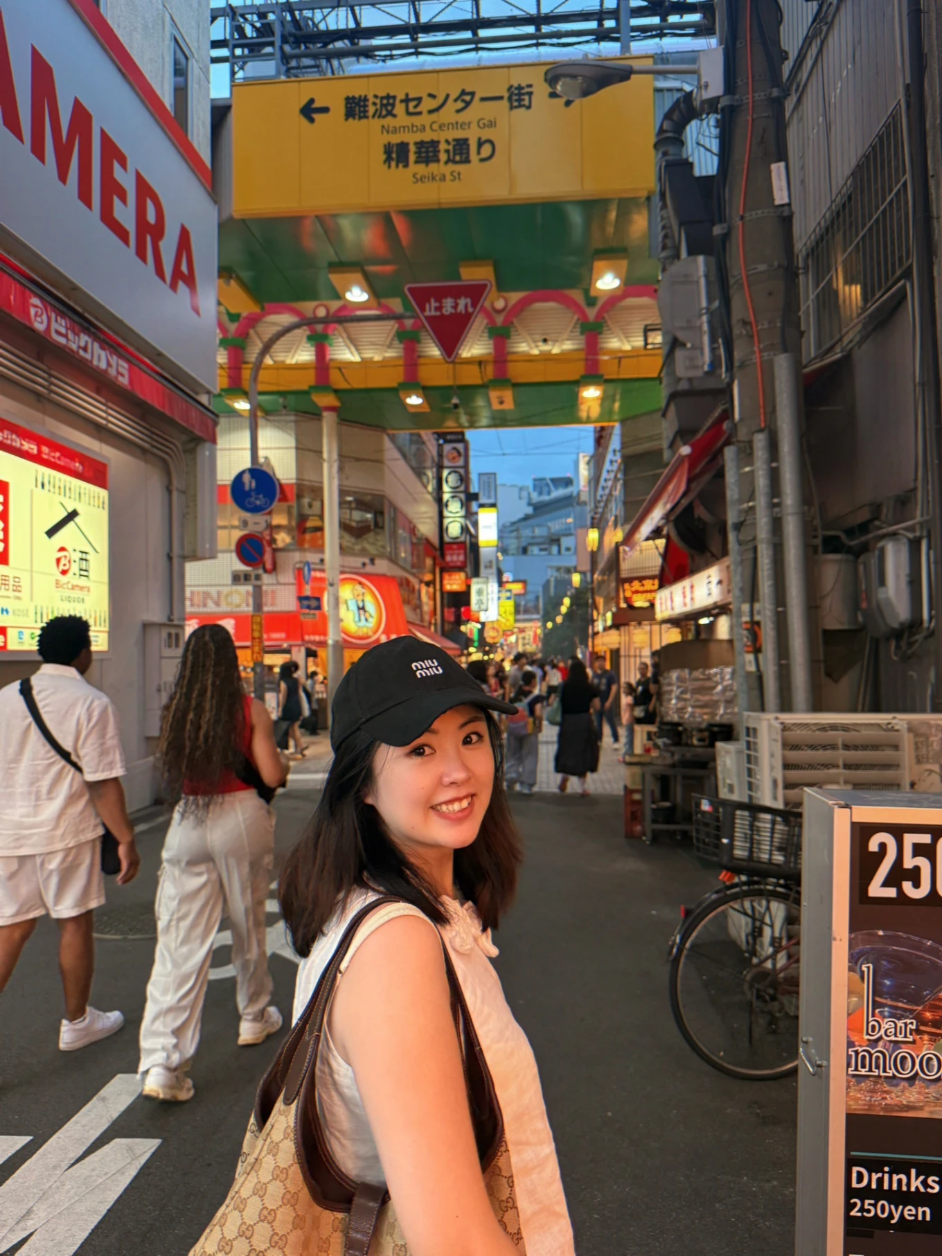 Woman exploring Namba Center Gai shopping street in Osaka during a seven-day Osaka, Kyoto and Kobe itinerary.