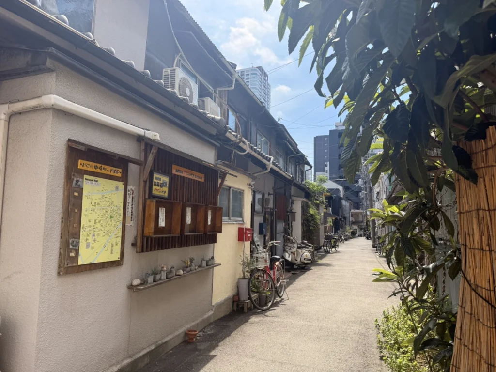 7-Day Osaka, Kyoto and Kobe Itinerary: Food, Shopping and Summer Sights 36 Quiet lane in Nakazakicho, Osaka, lined with traditional low-rise houses, bicycles and small local businesses.