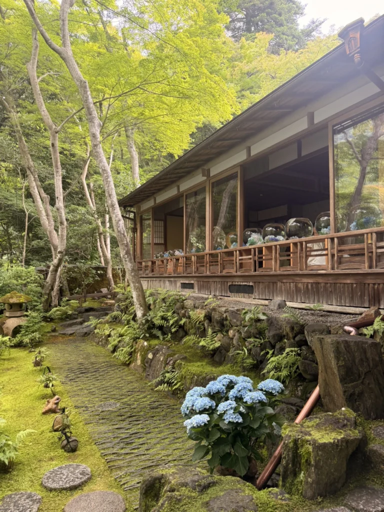 Traditional wooden exterior of Arashiyama Yusai-tei overlooking the moss garden