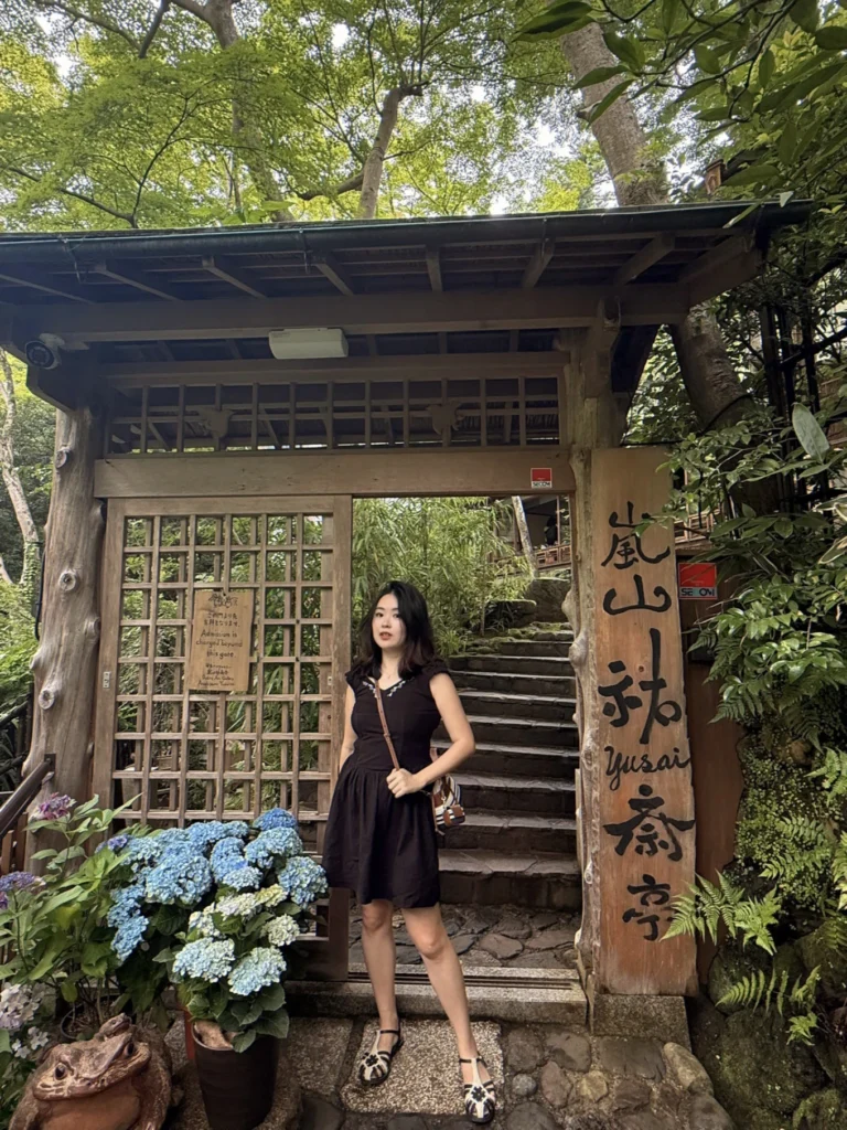 Traditional entrance gate of Arashiyama Yusai-tei with seasonal hydrangeas in Kyoto