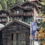 CERVO Mountain Resort wooden alpine chalets surrounded by larch trees in Zermatt, Switzerland